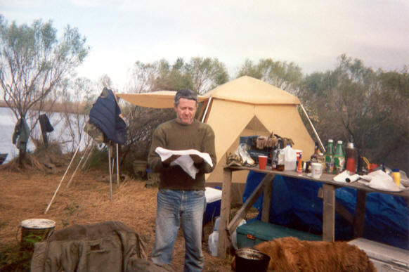 Dick preparing to wash his face at the campsite.
