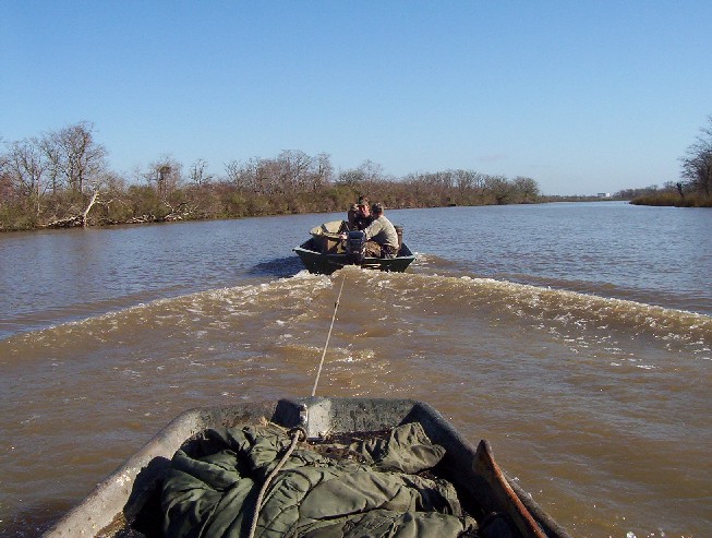 Being towed back to the launch Sunday morning after the mud boat overheated.