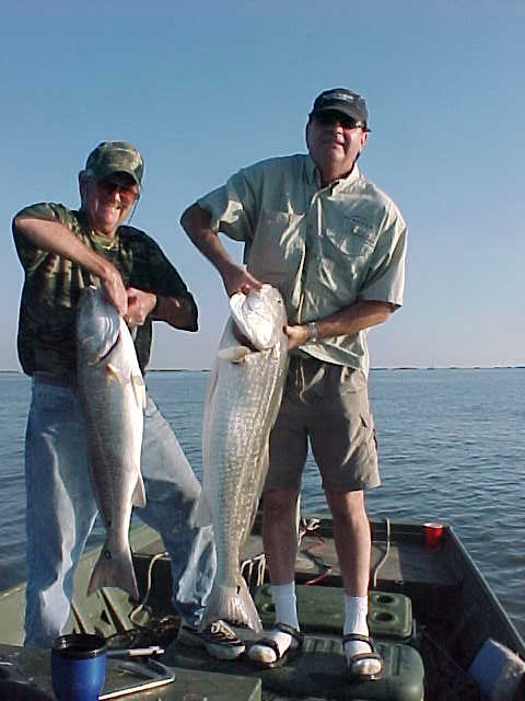 Dick and Joe Pecot holding their "double" catches on Thursday 11/6/03.